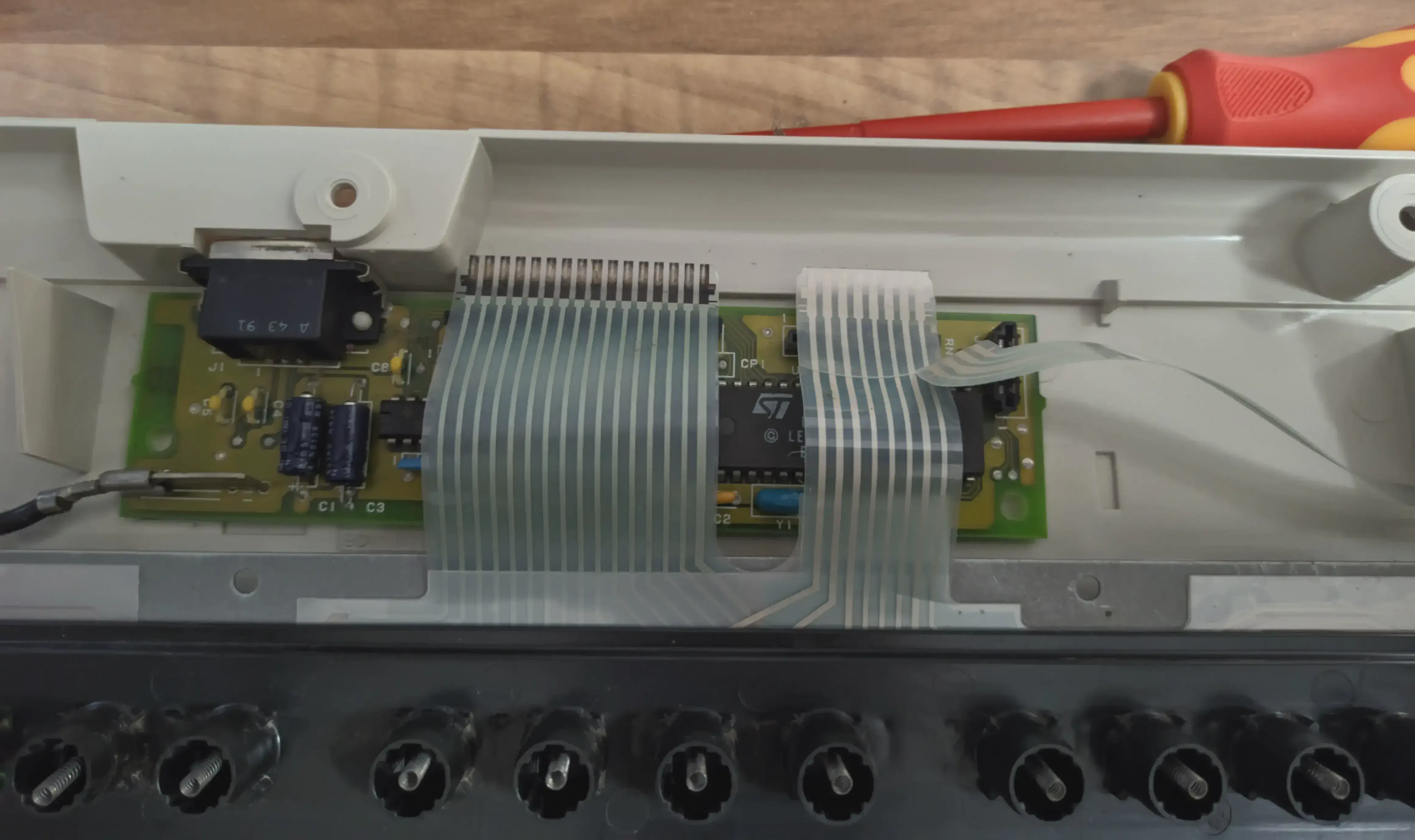 The original keyboard controller. The wires ran under the board, but I snipped them.